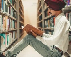 The benefits of reading for students are evident in this image as it shows a man immersed in reading